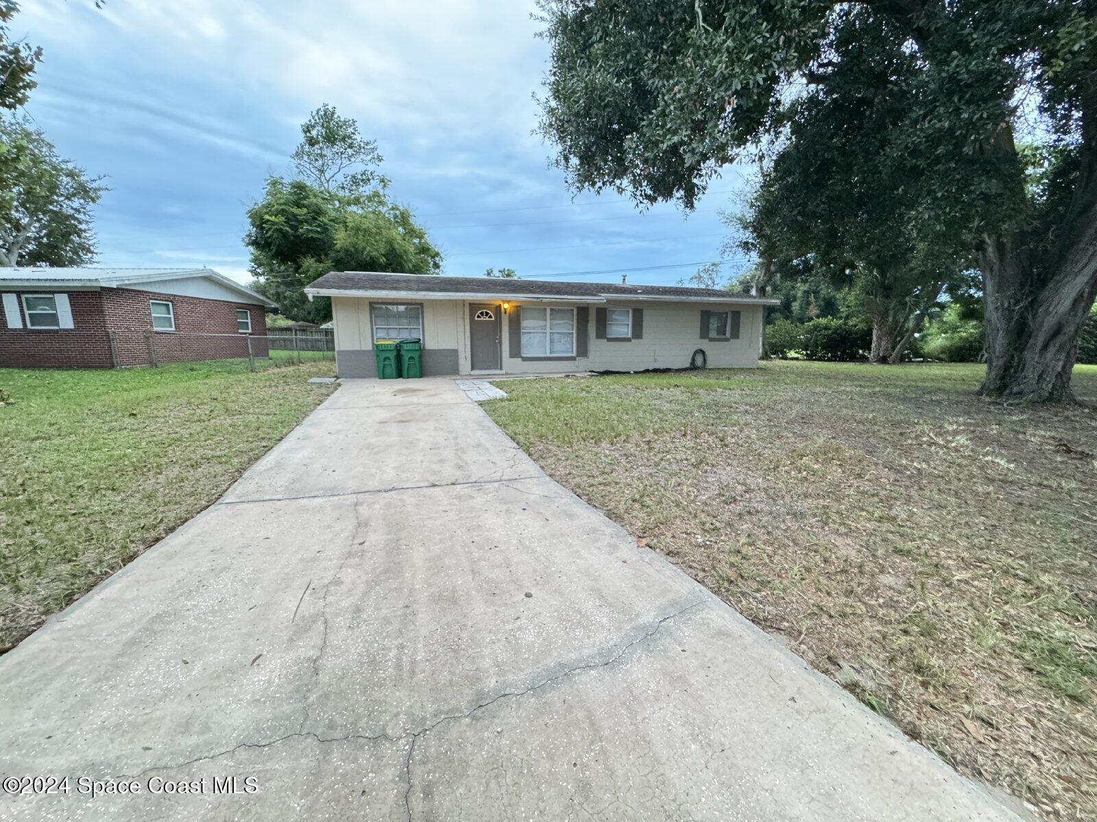 front view of a house with a yard