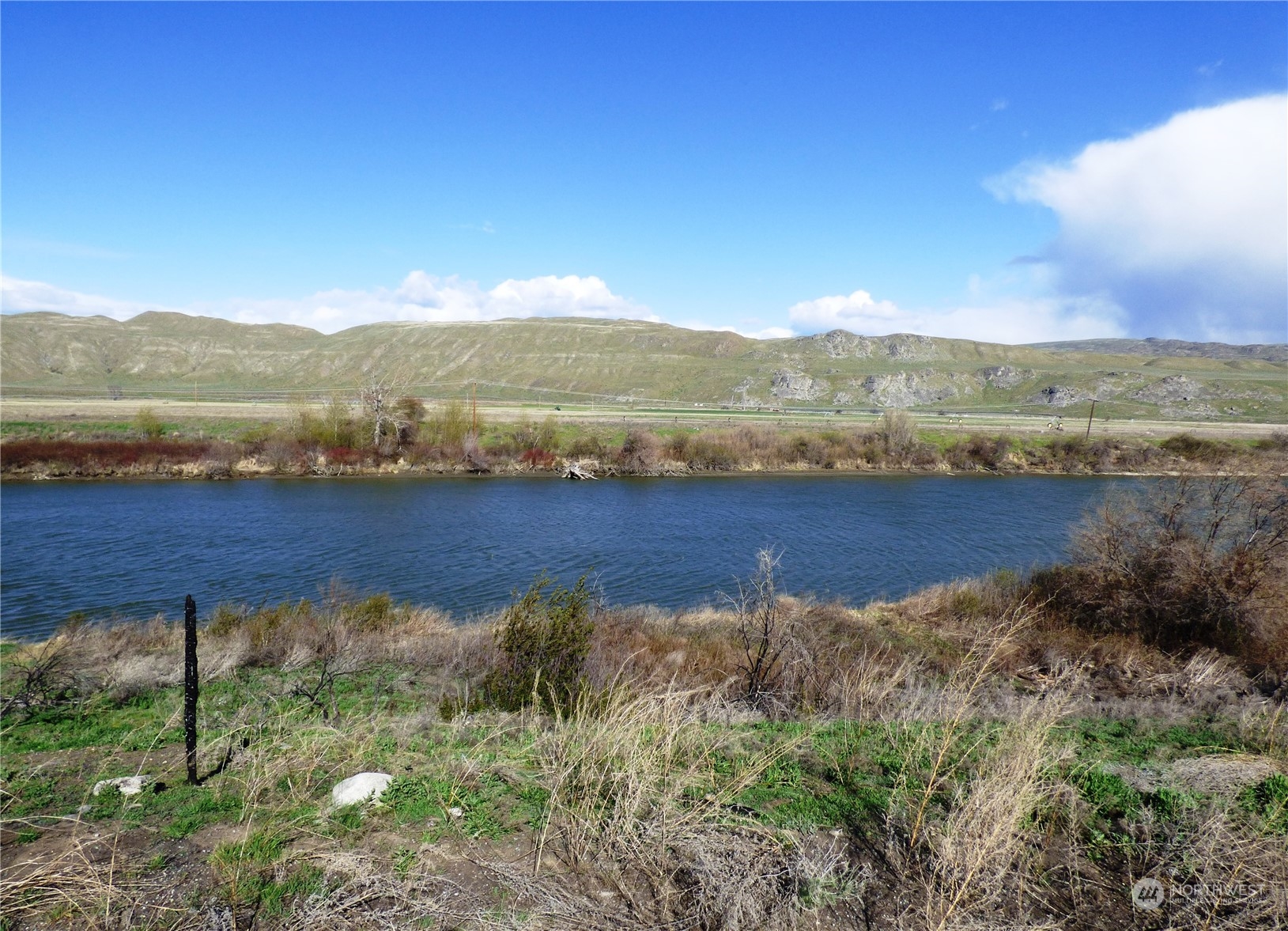 a view of a lake with mountains in the background