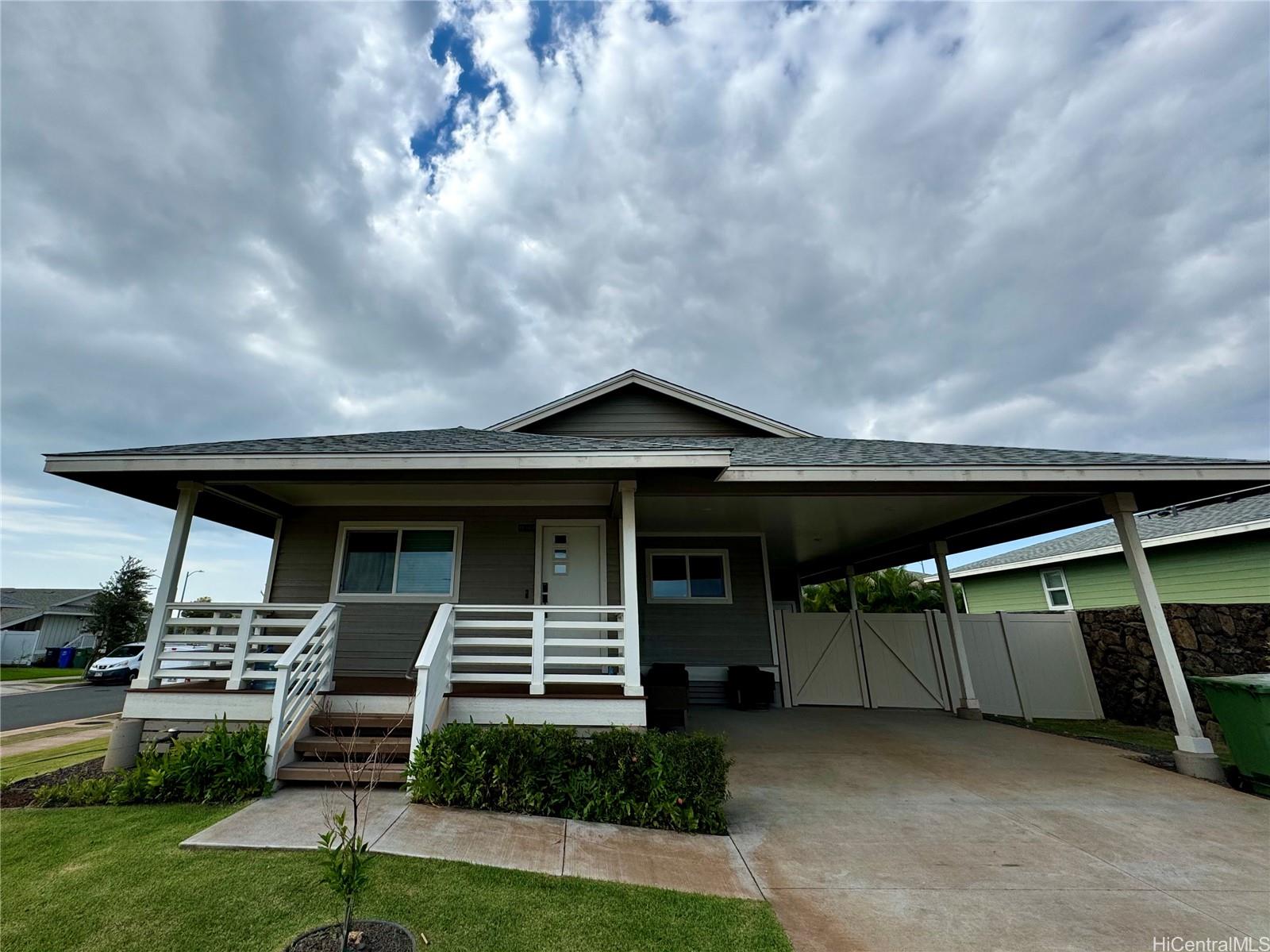 a front view of house with yard and outdoor seating