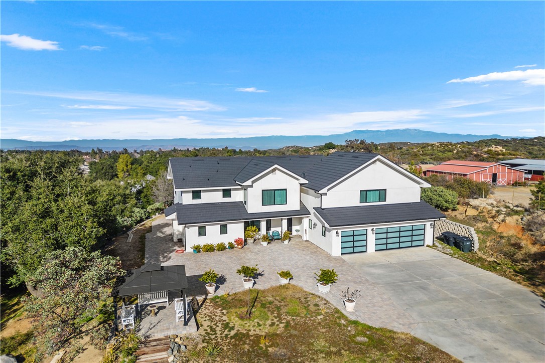 aerial view of a house with a yard