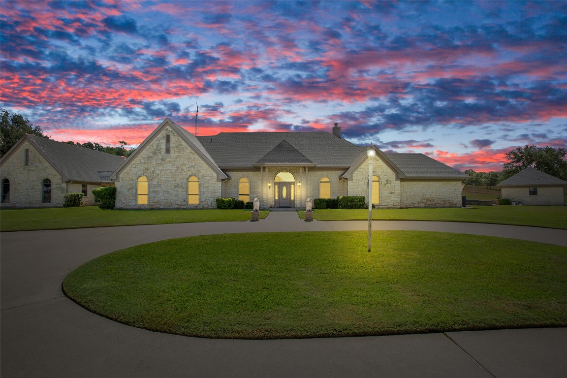 a front view of a house with swimming pool