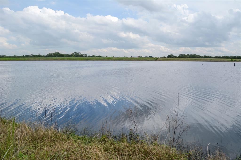 a view of a lake next to a building