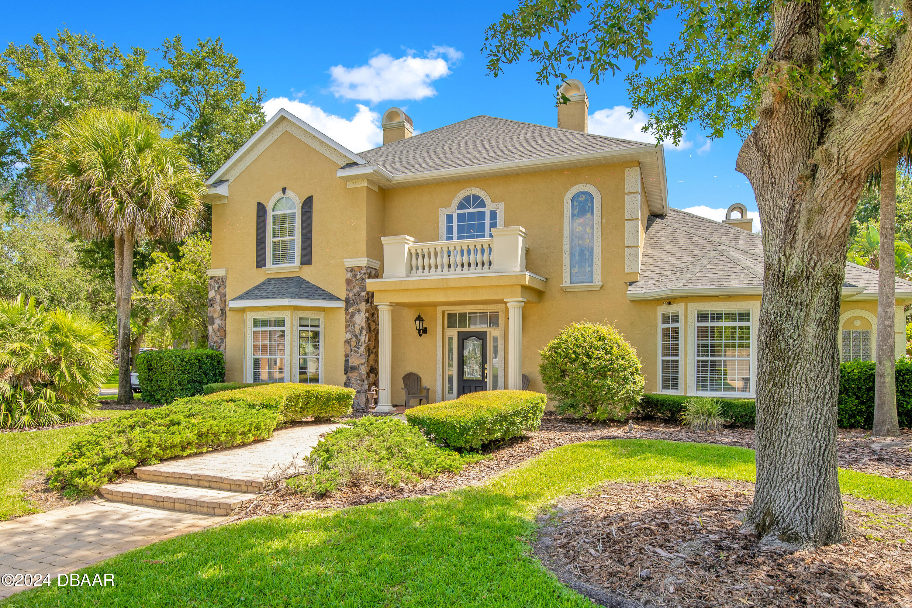 a front view of a house with a yard