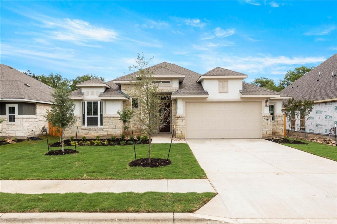 front view of a house with a yard