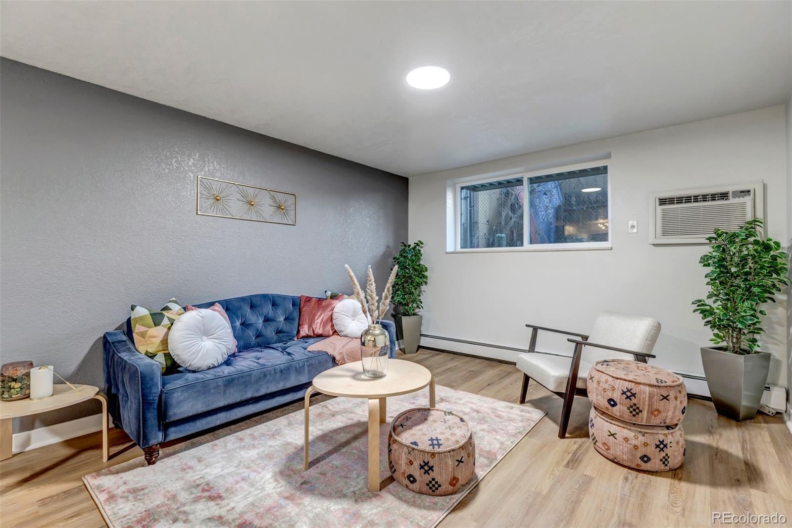 a living room with furniture and flowers