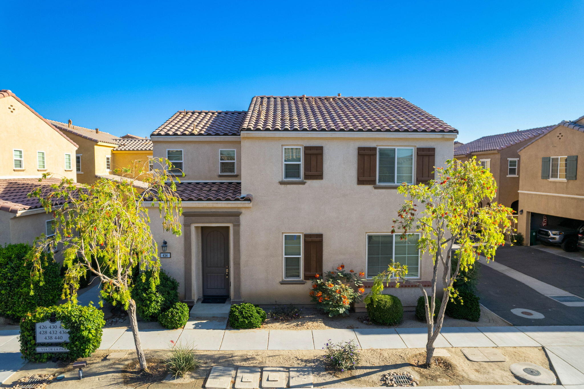 a front view of a house with a yard