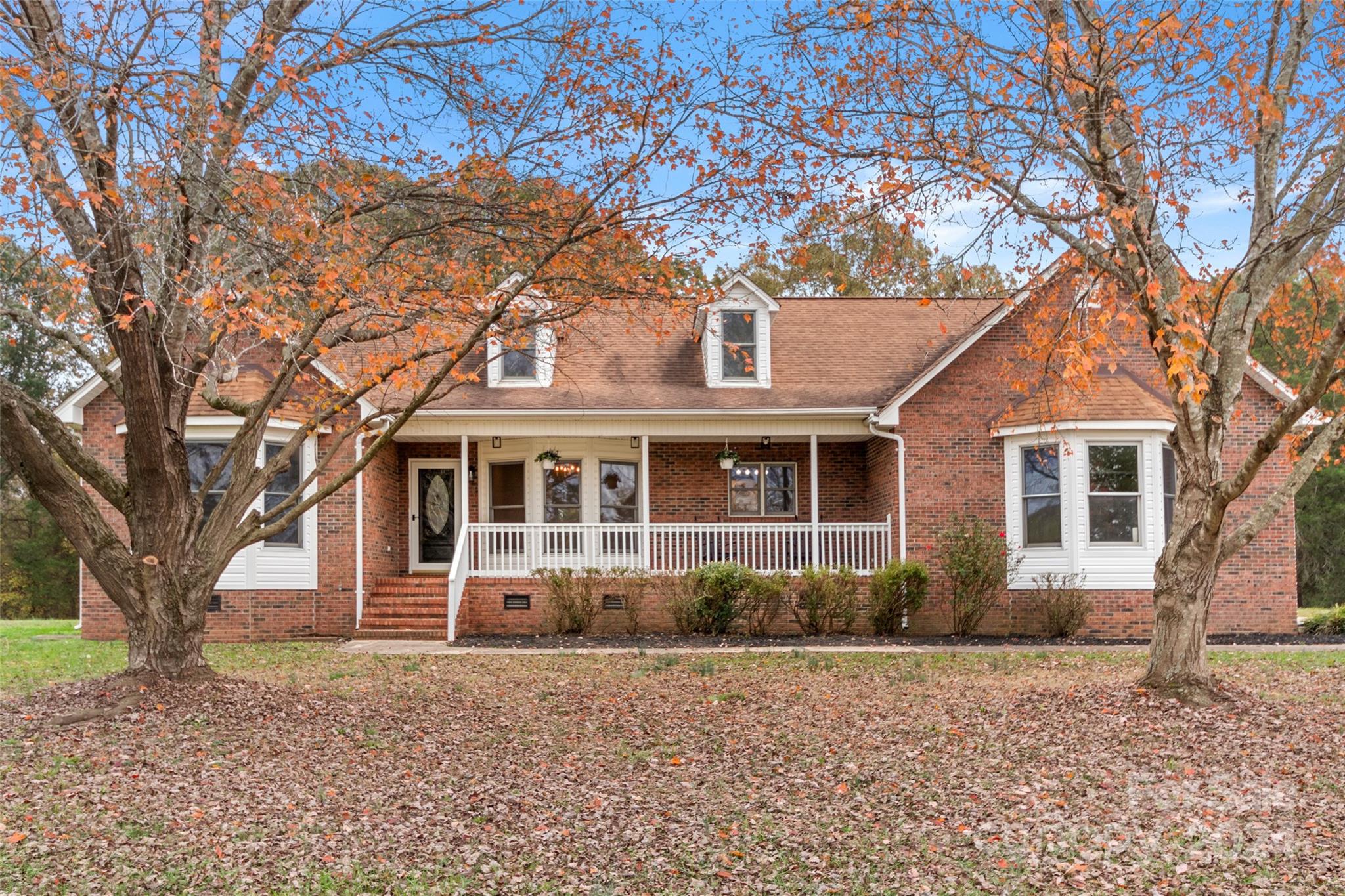 front view of a house with a trees