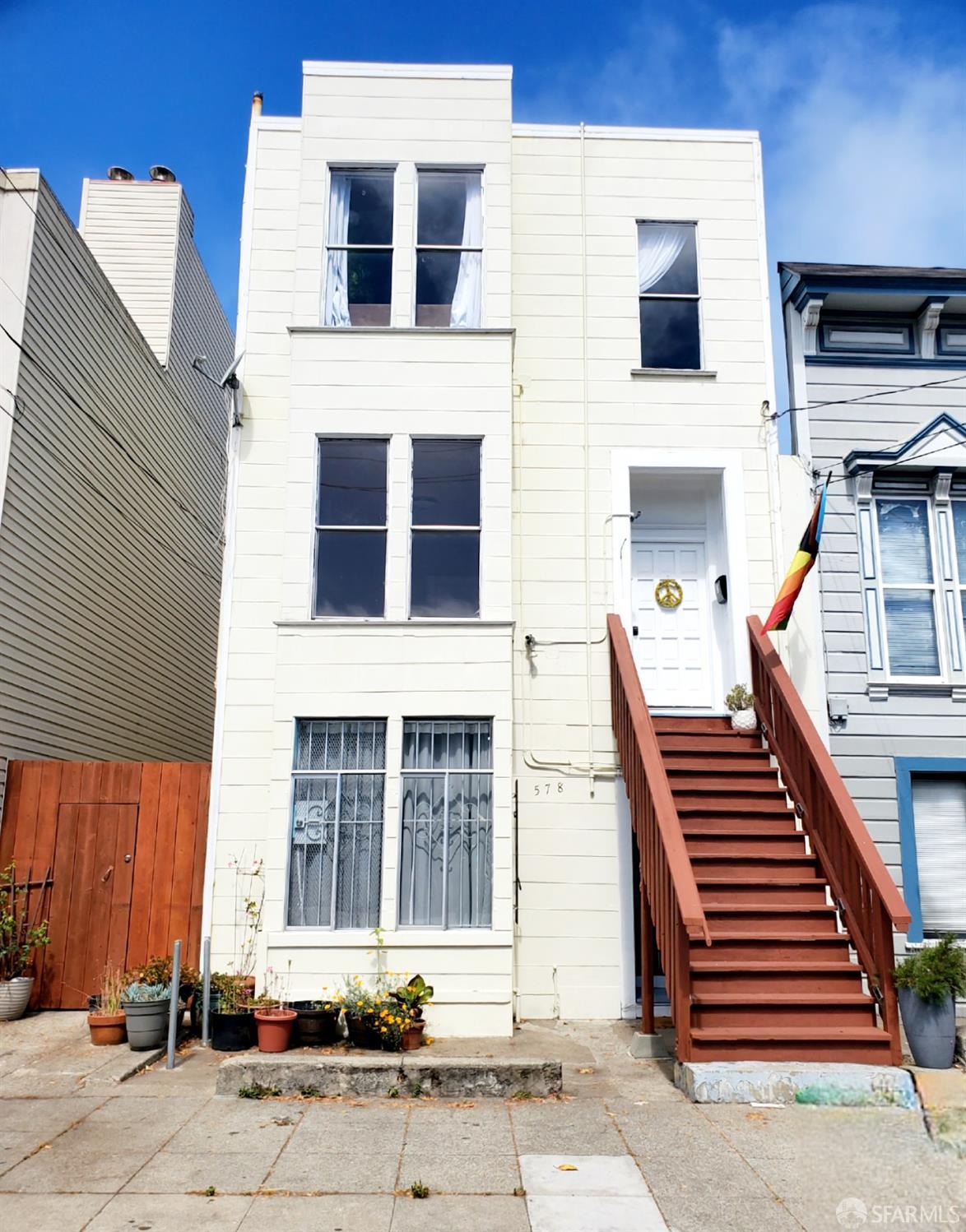 a front view of residential houses with stairs