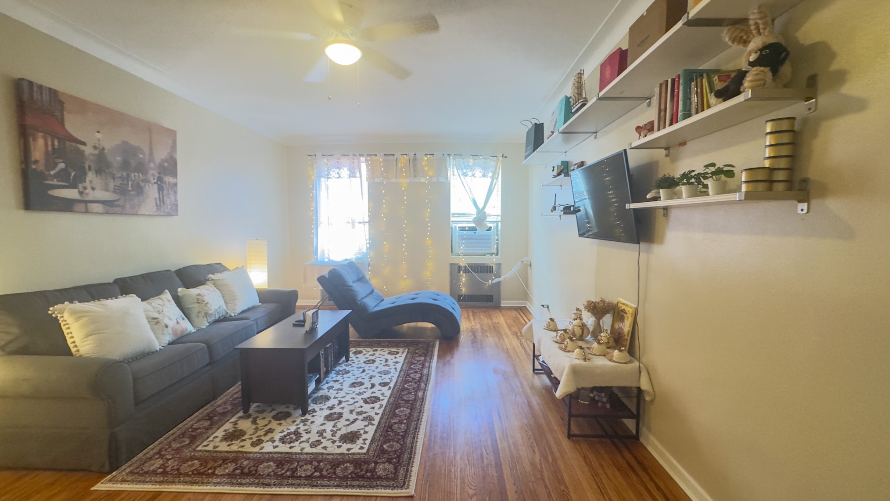 a living room with furniture and a rug