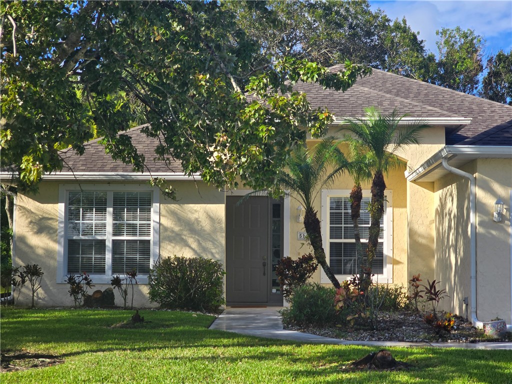 front view of house with a yard