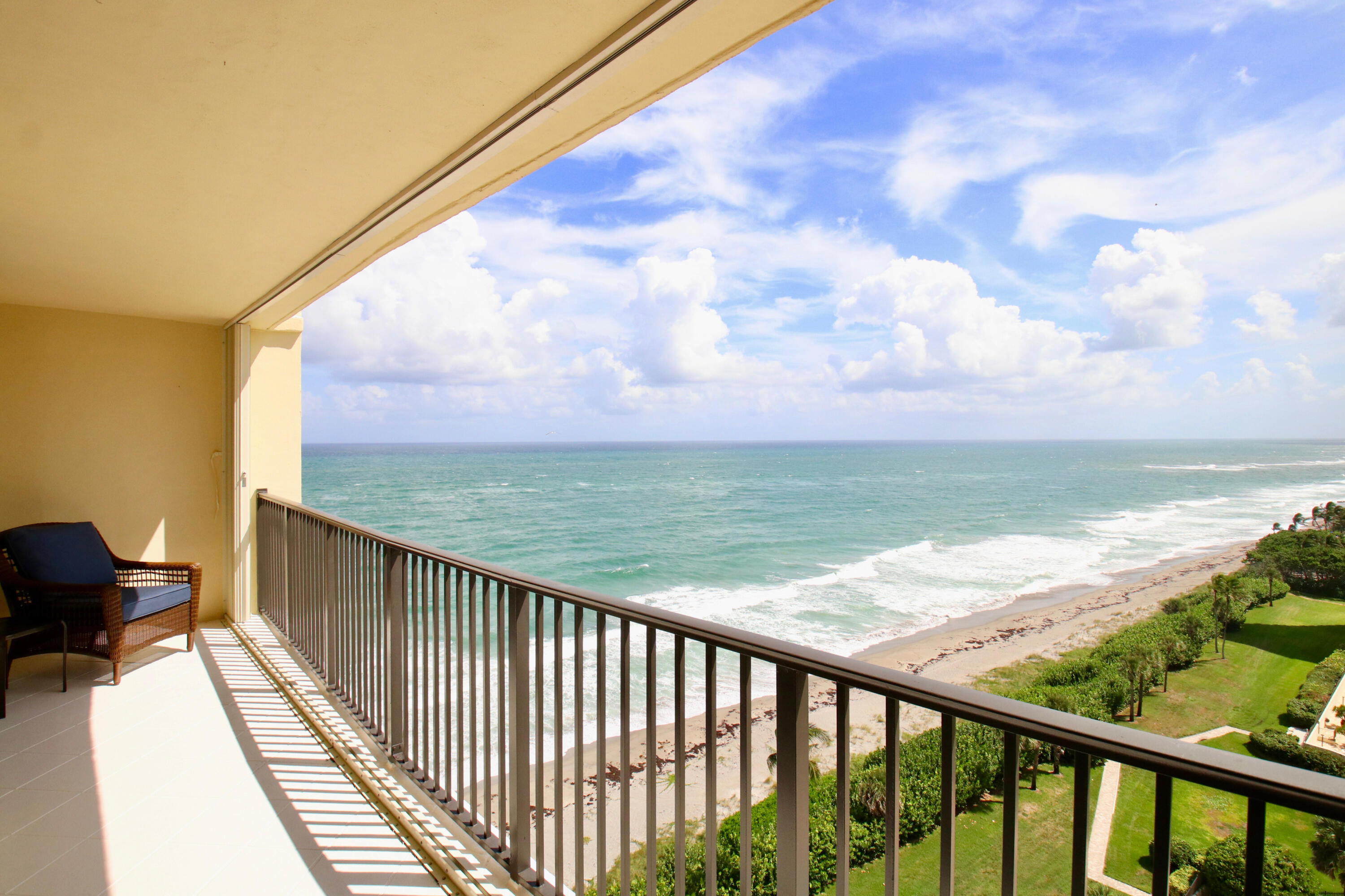 a view of a balcony with an ocean view