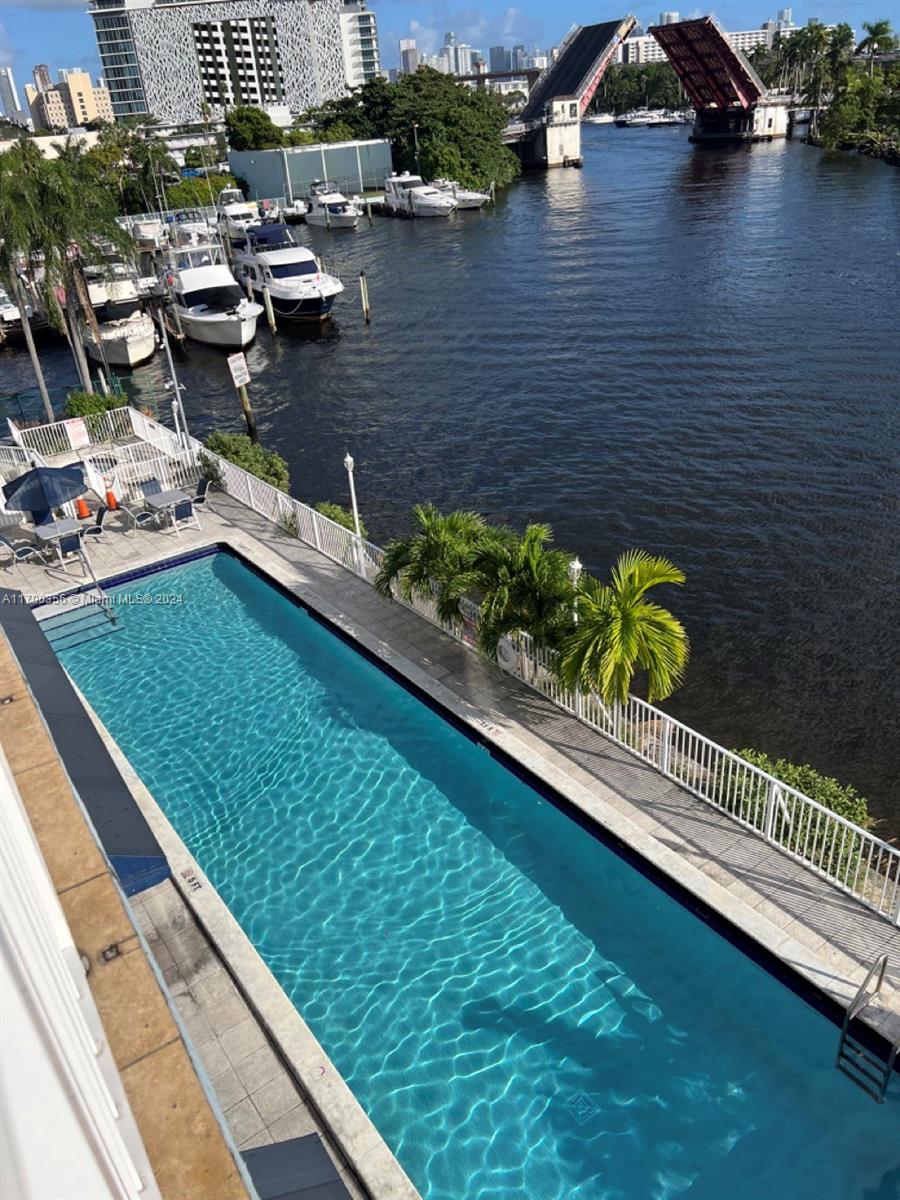 a view of swimming pool from a balcony