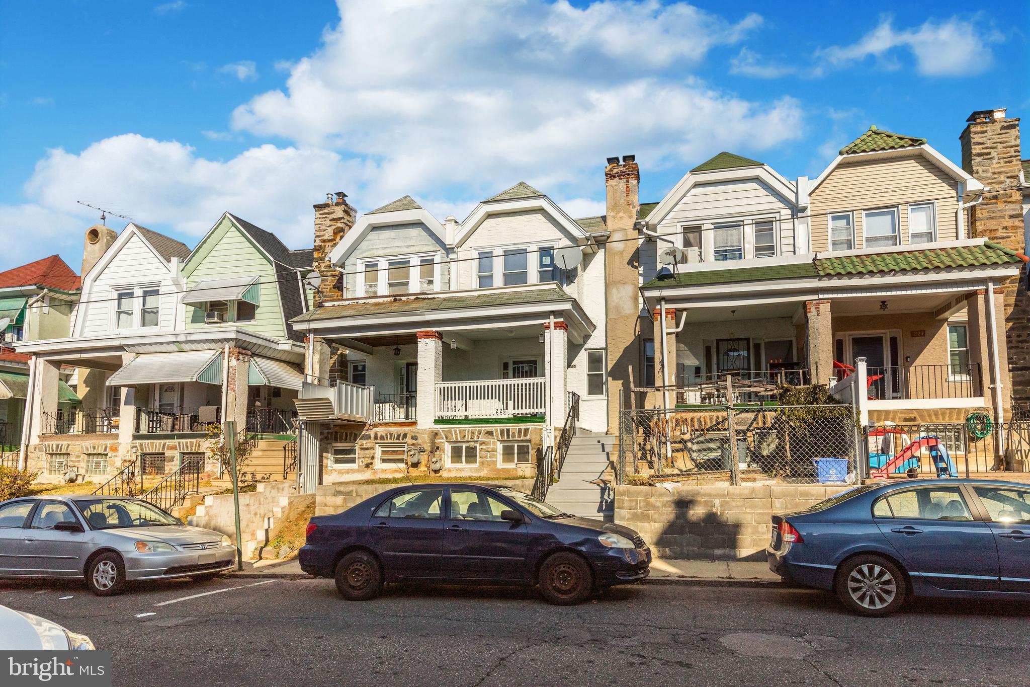 a view of a car parked in front of a houses