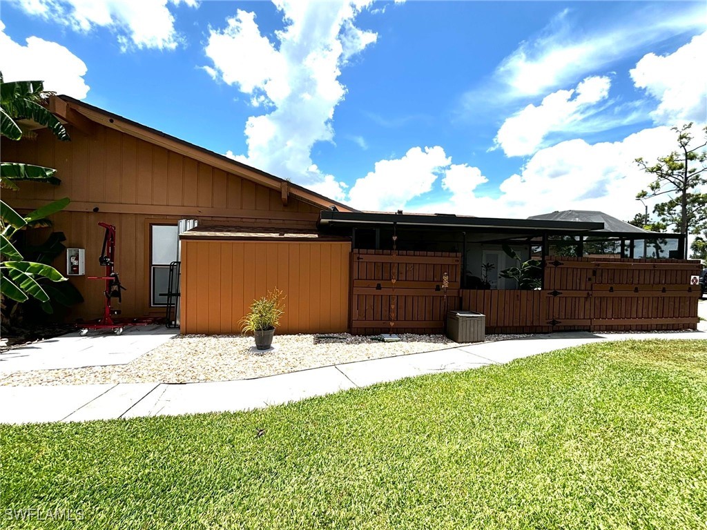 a view of house with yard