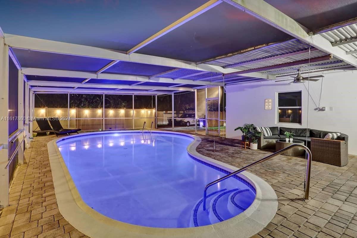 a view of a swimming pool with chairs