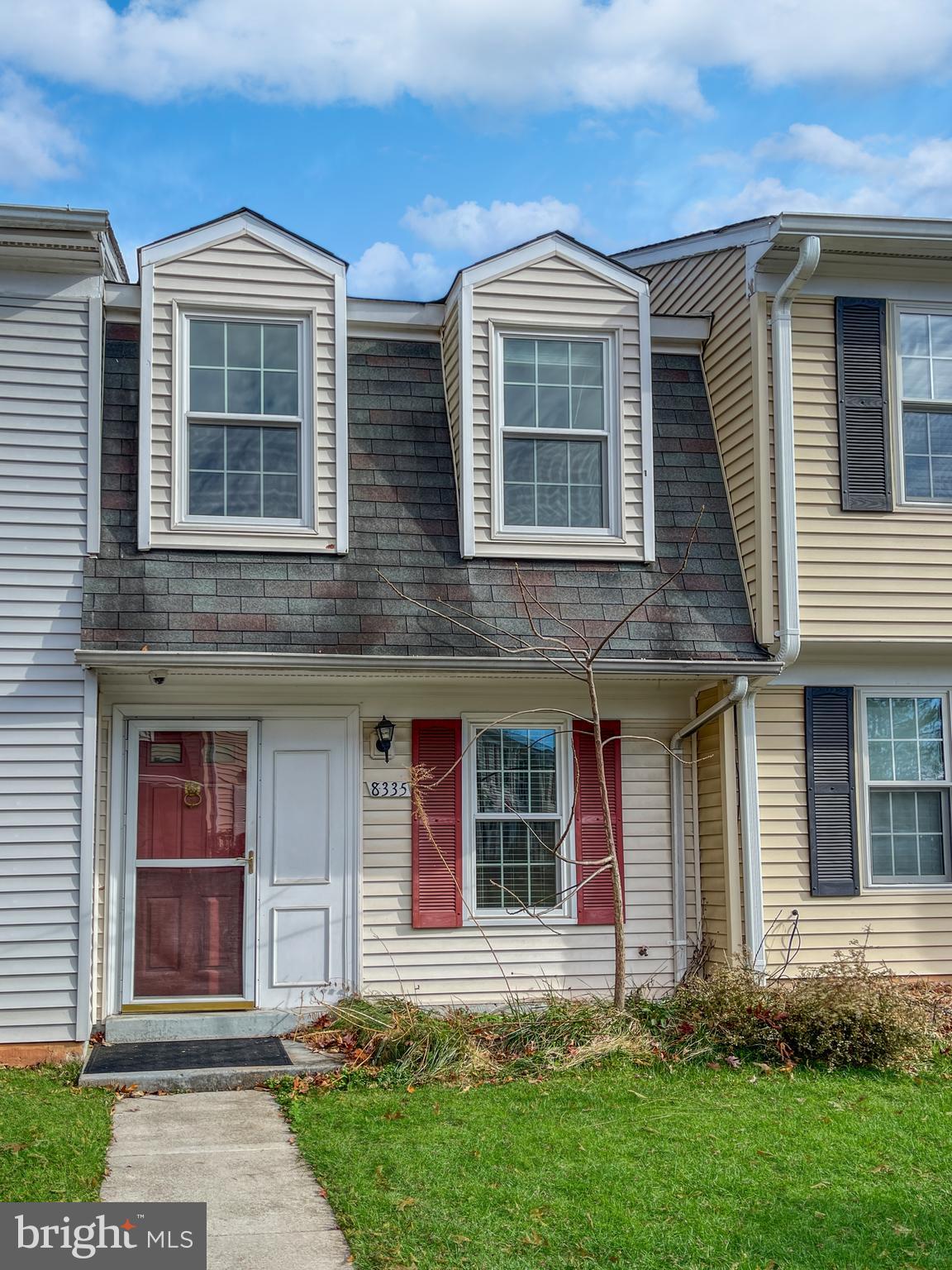 a front view of a house with a yard