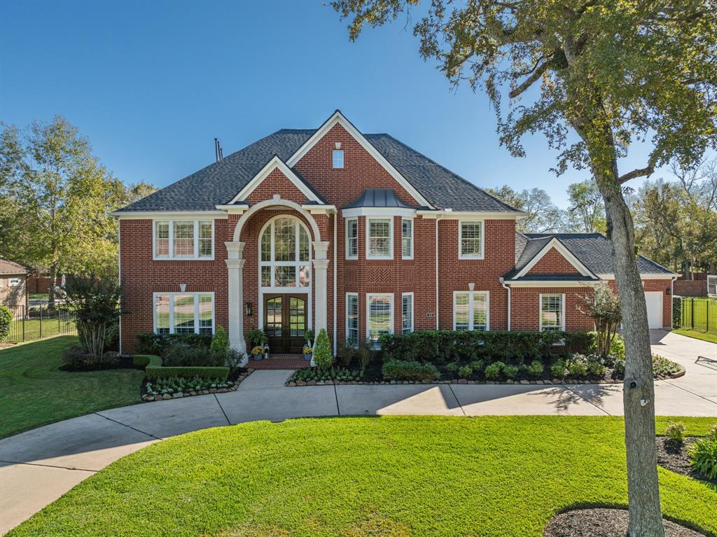 Impressive masonry work and rock detailing enhance the elegant appeal of this abode. Boasting a circle driveway, a long driveway and a three-car garage there is never a shortage of parking or storage.