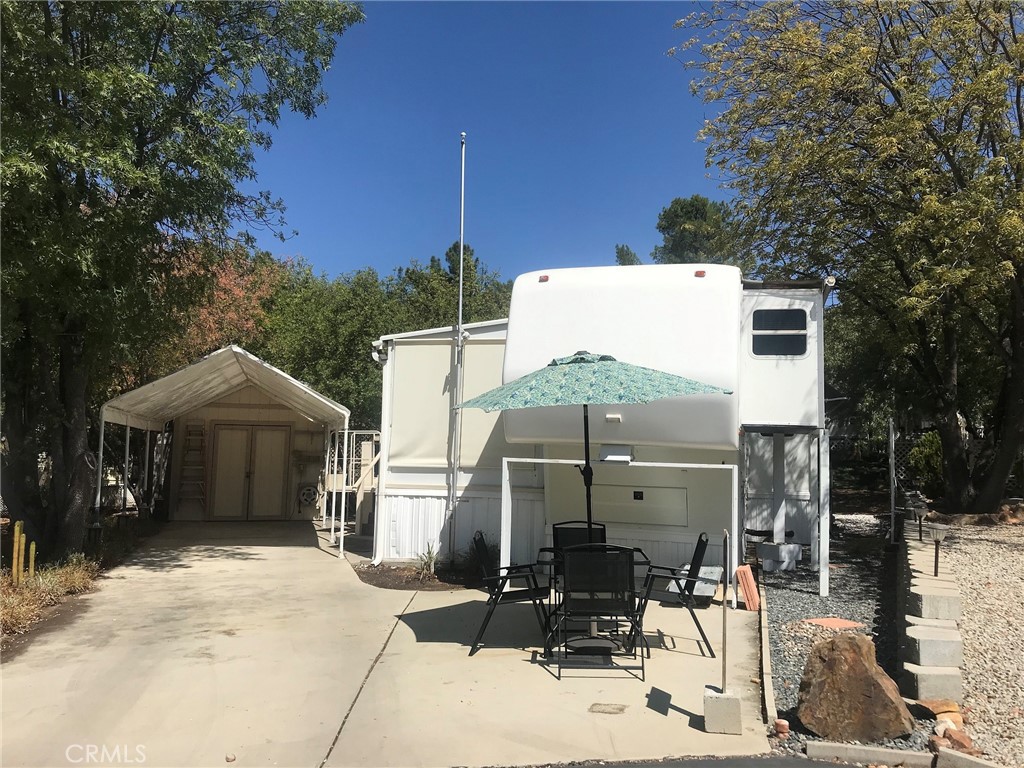 a front view of a house with yard and seating area