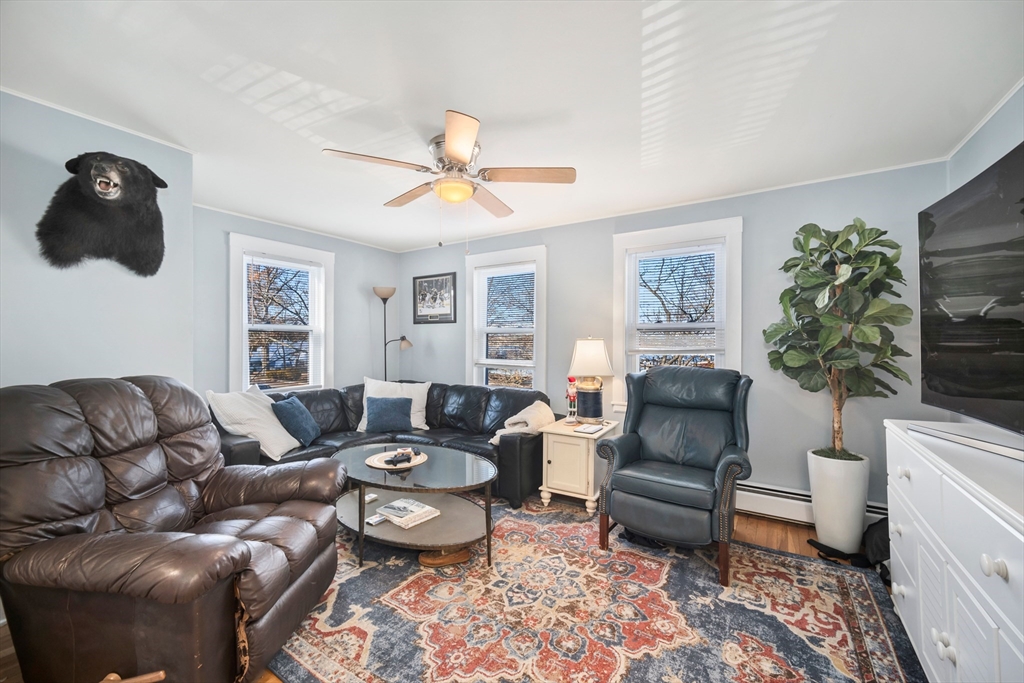 a living room with furniture and a rug