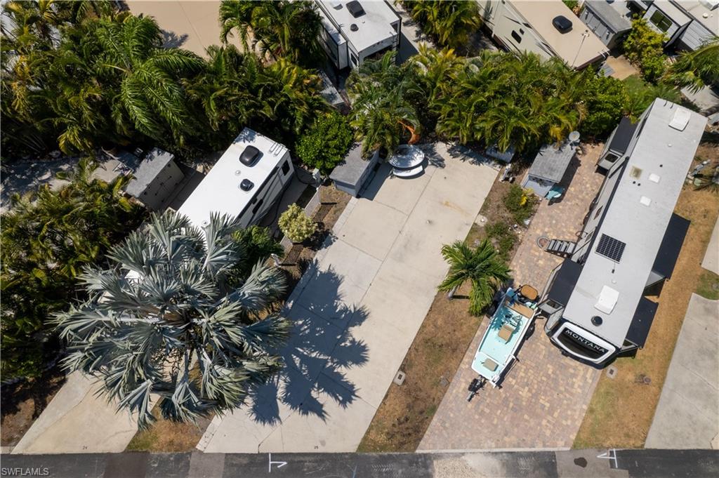 an aerial view of a house with a yard and garden