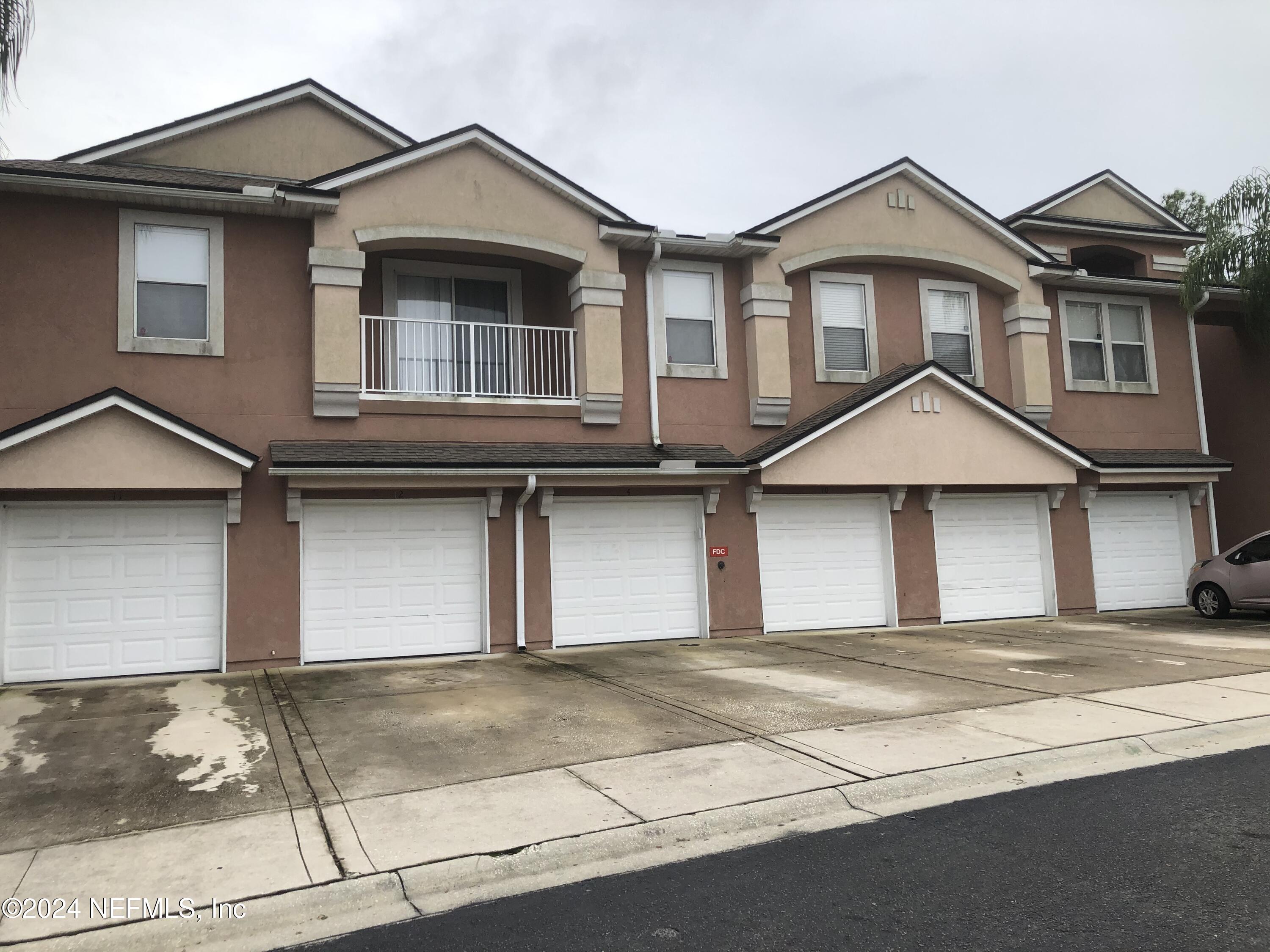 a front view of a house with a garage