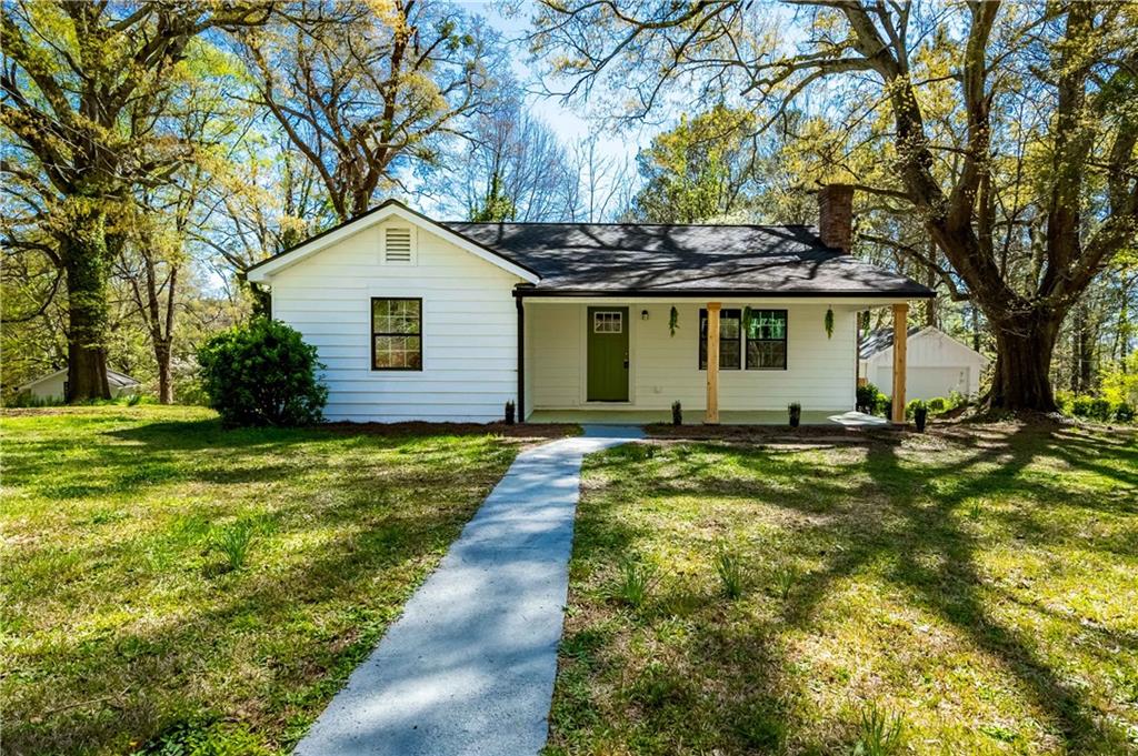 a front view of house with yard and green space