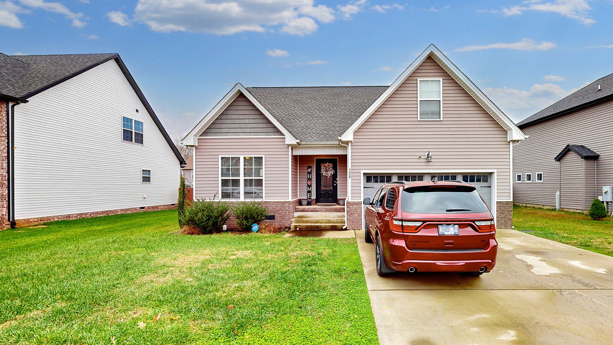 a car parked in front of a house