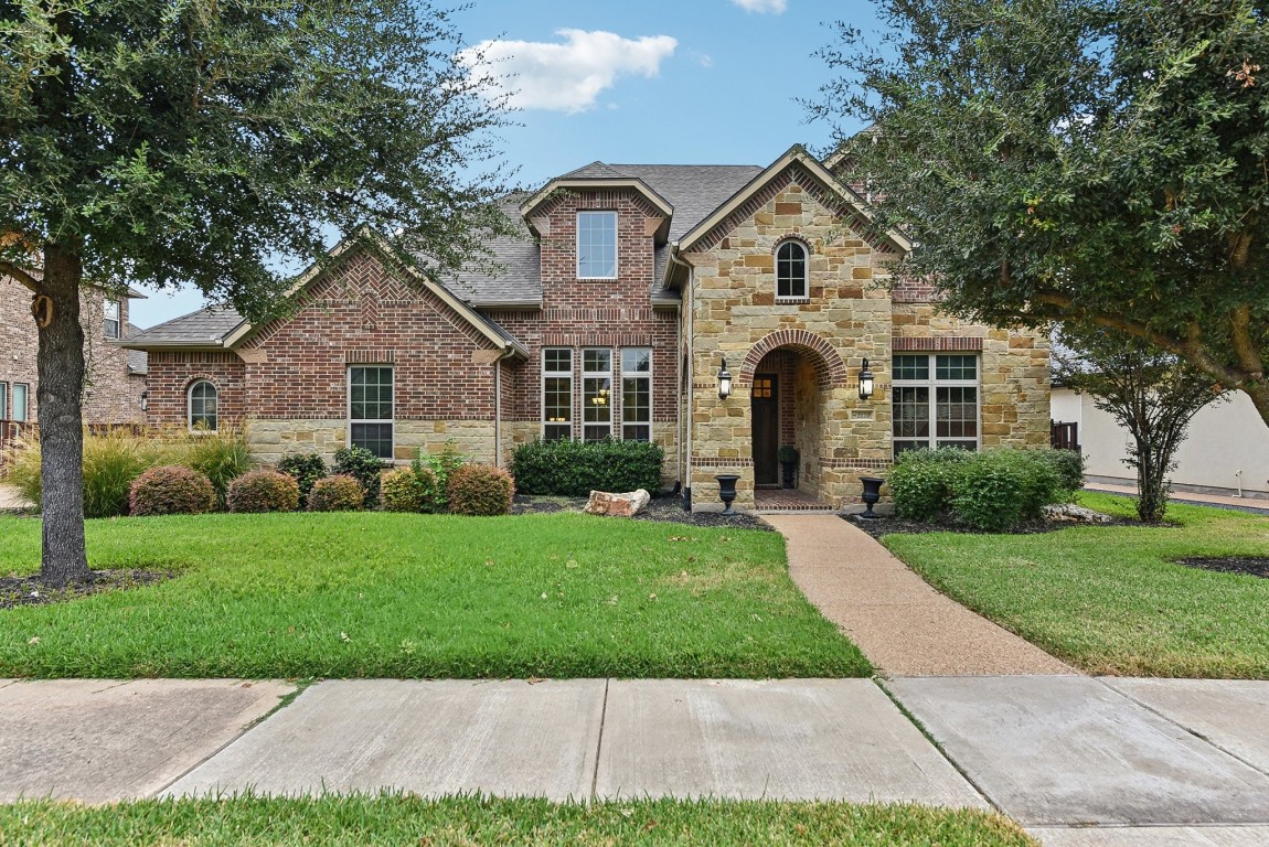 a front view of a house with a yard