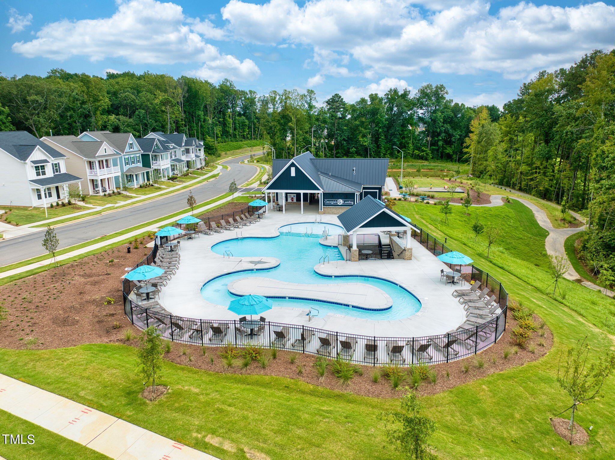 a swimming pool with outdoor seating and yard