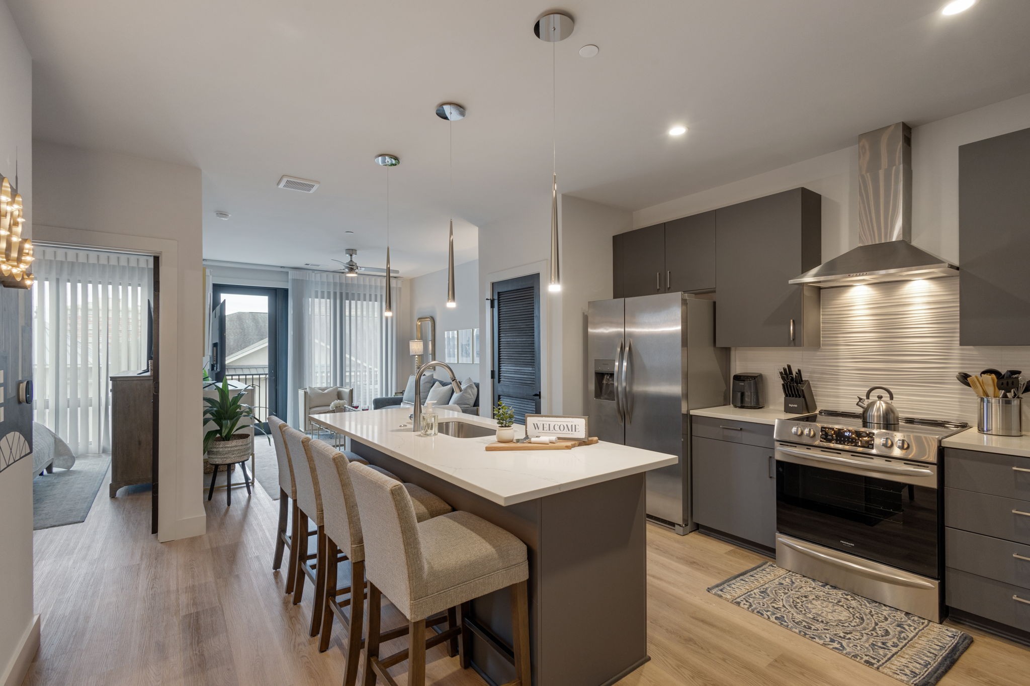 a large kitchen with a table and chairs