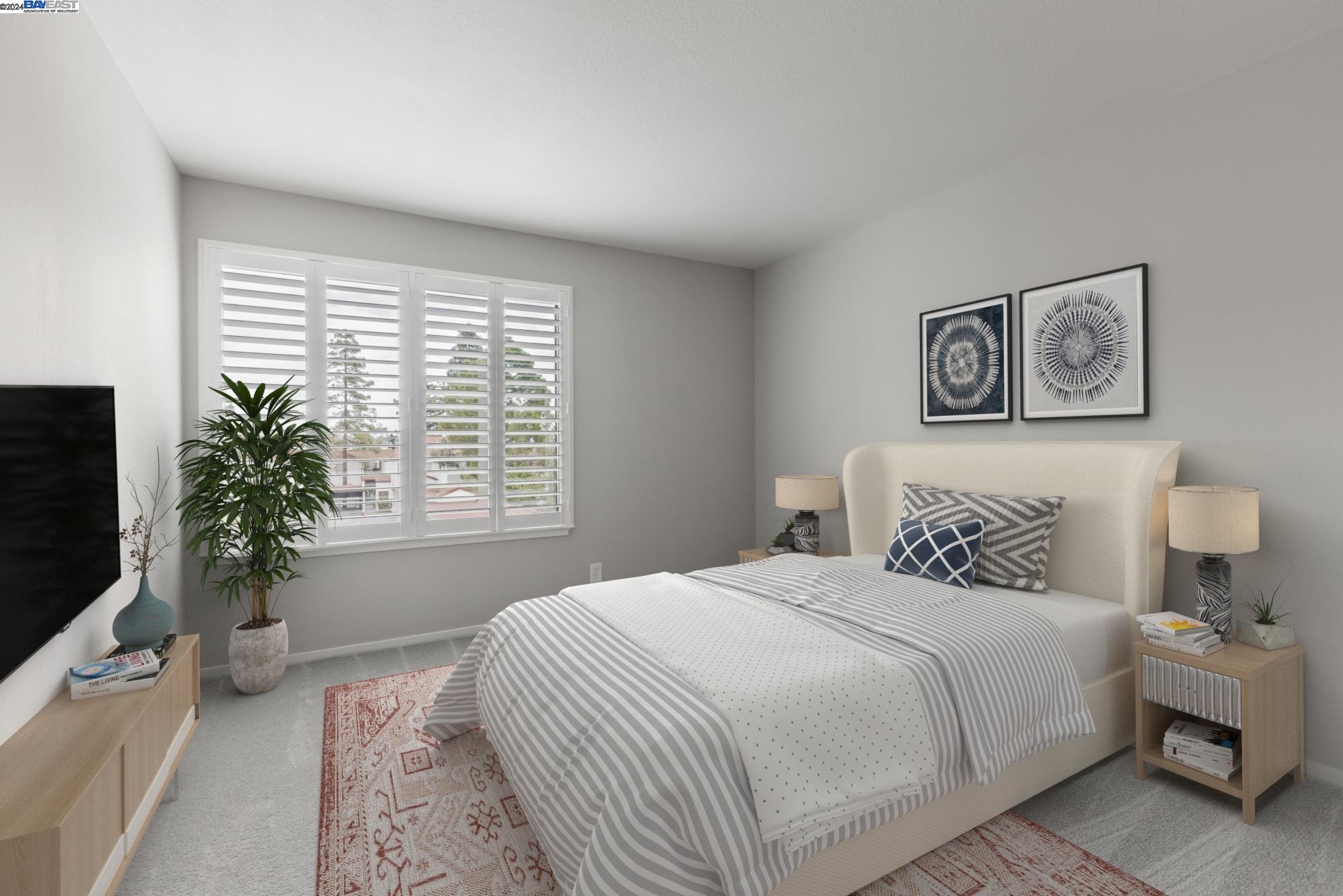 a bedroom with a bed and a potted plant