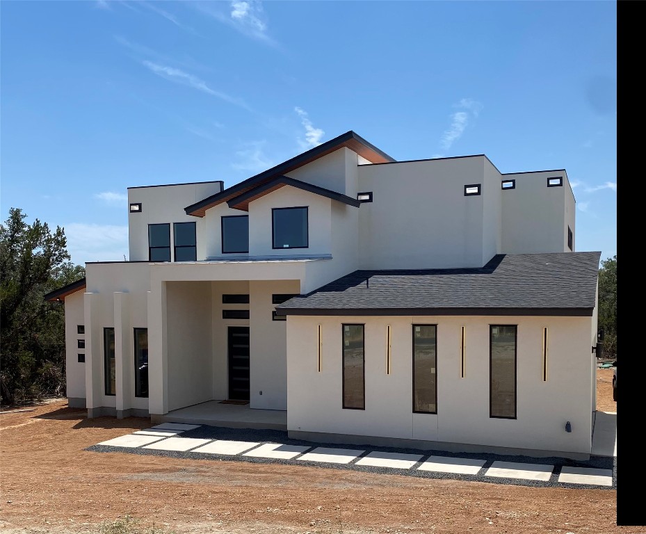 a front view of a house with a garage