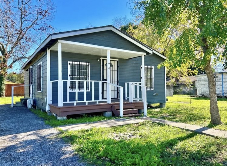 front view of a house with a yard