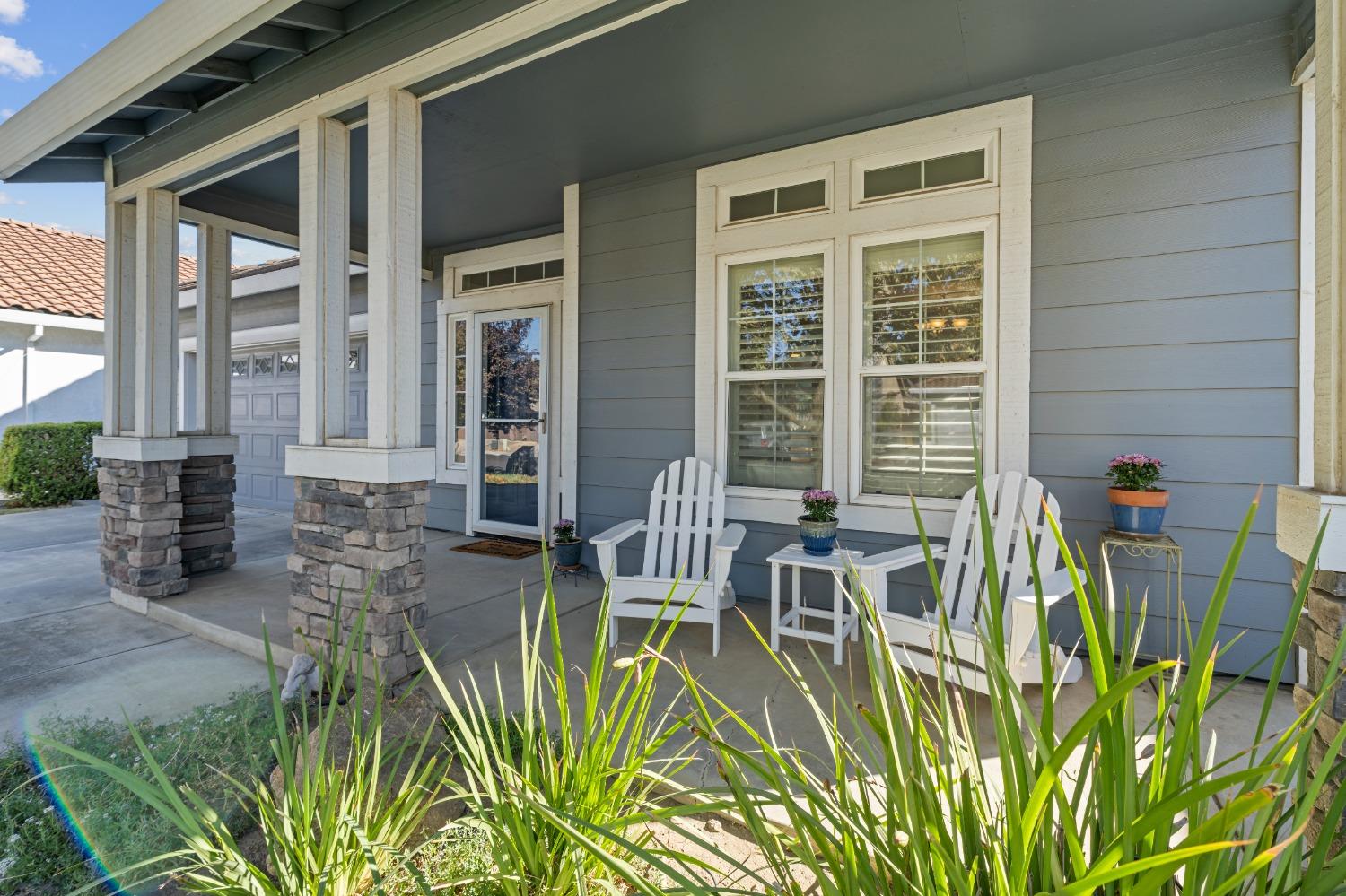 a view of a patio with table and chairs