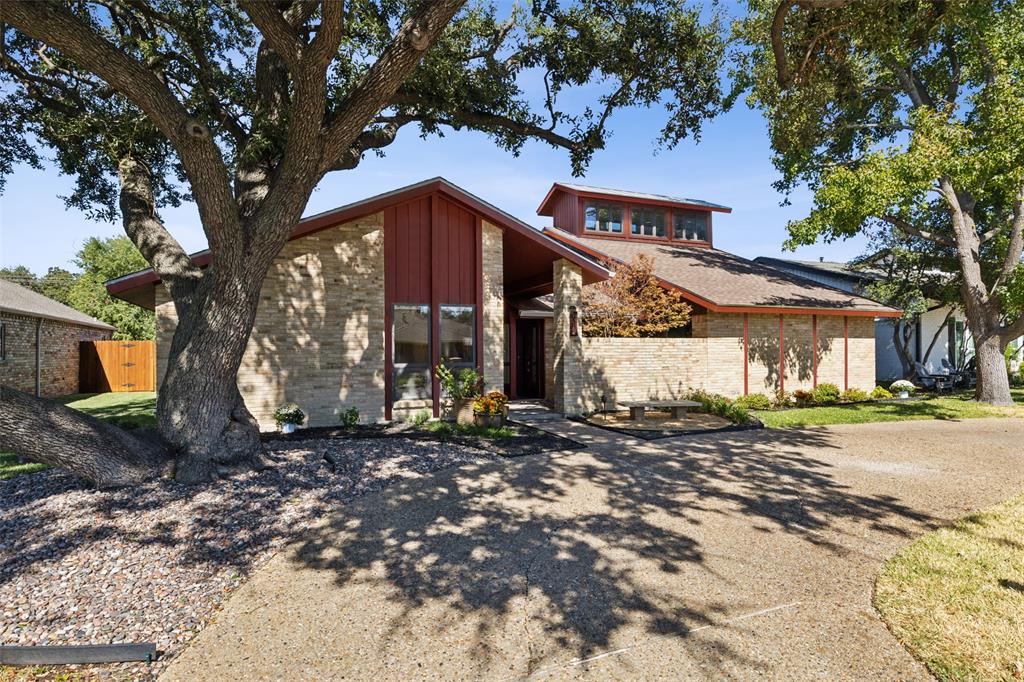 a view of a house with a tree