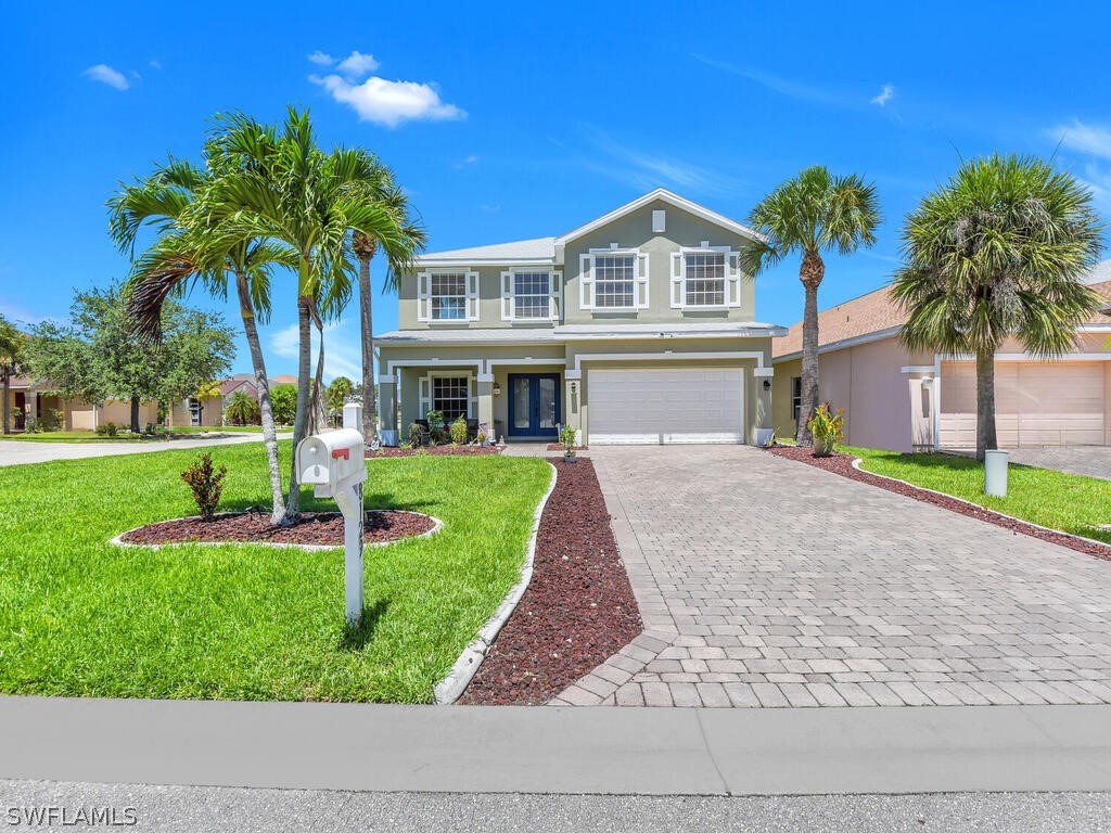 a front view of house with yard and green space