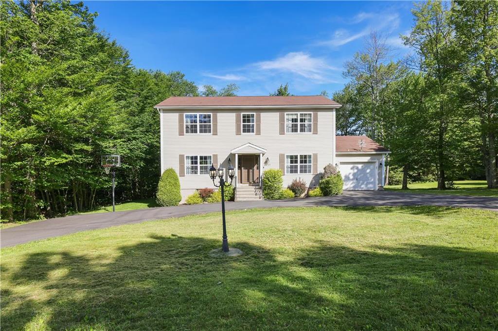 a view of a house with a backyard