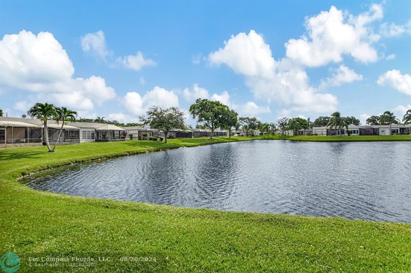 a view of a lake with a big yard