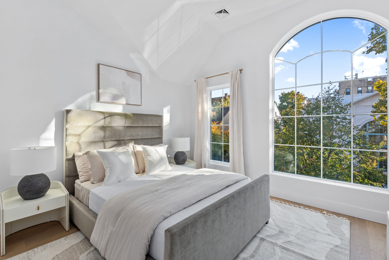 a bedroom with a bed and window