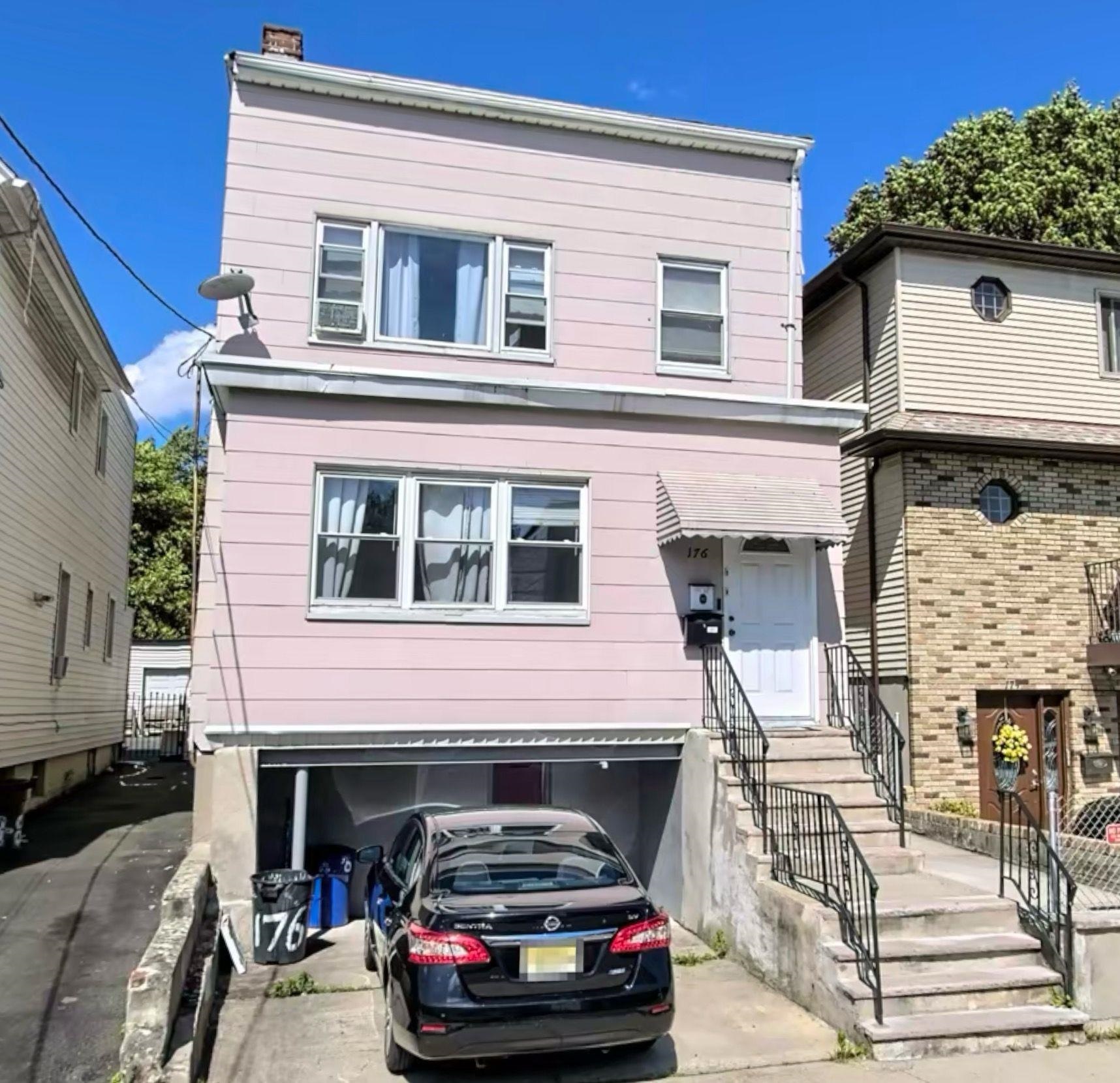 a car parked in front of a house