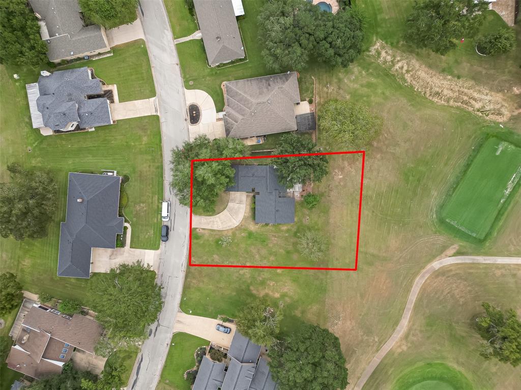 an aerial view of a house with outdoor space