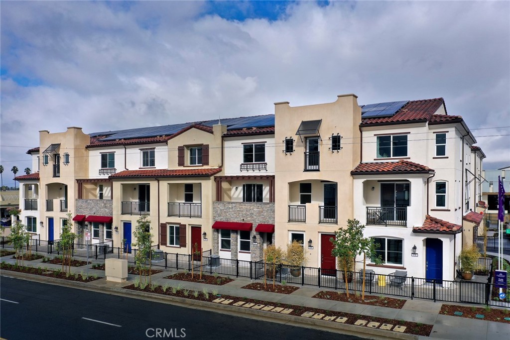 a front view of residential houses with street