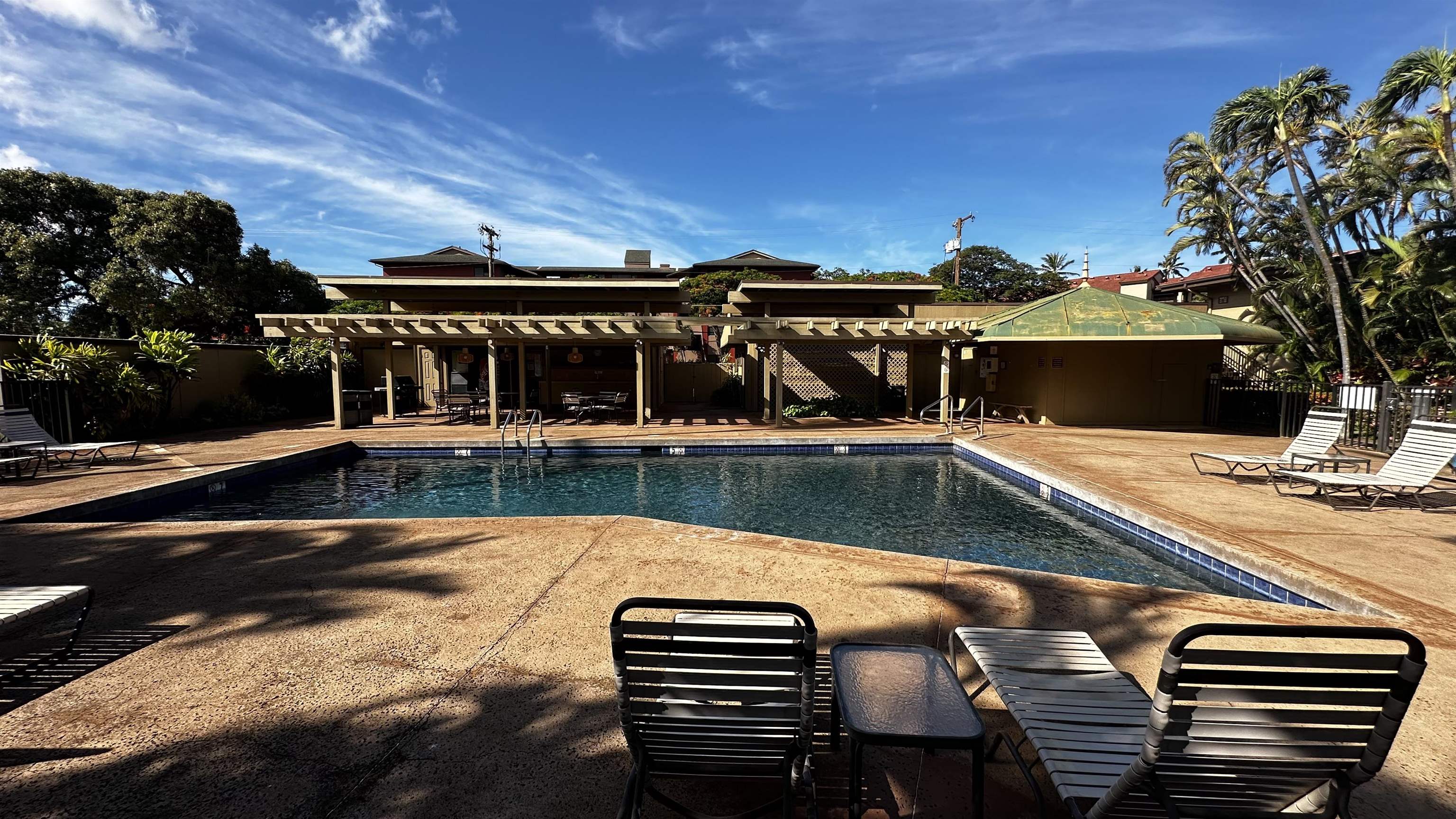 a view of a swimming pool with a patio