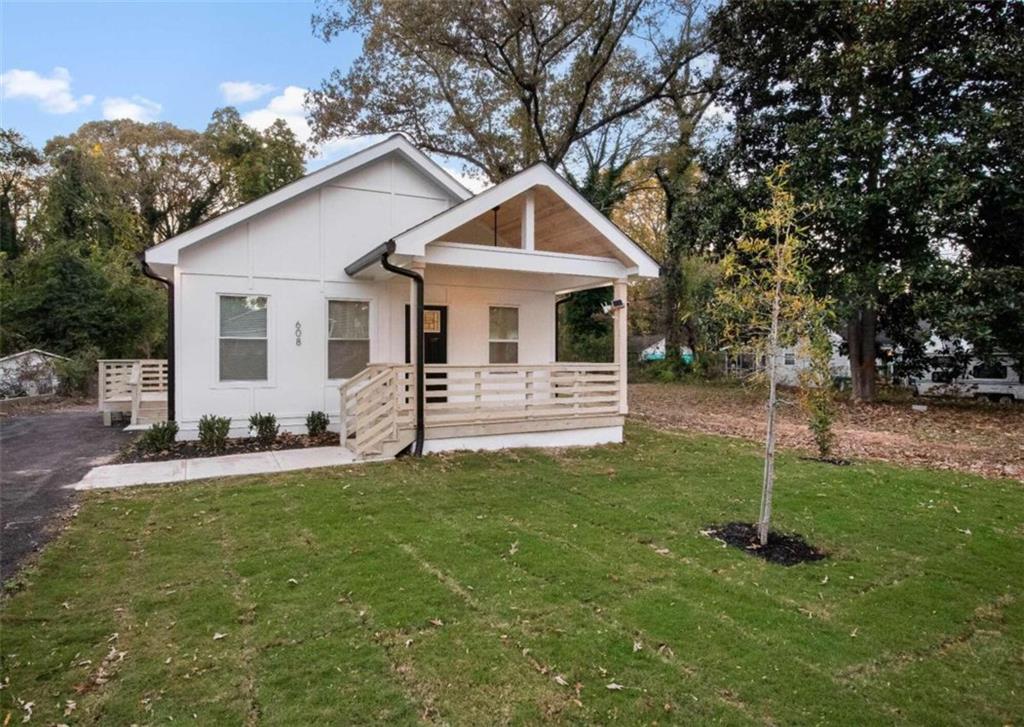 a front view of a house with a yard