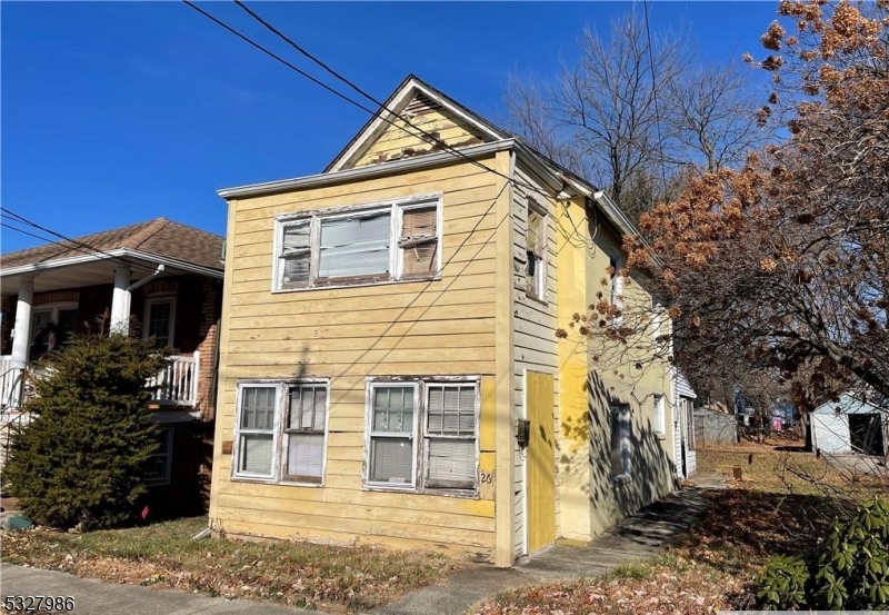 a view of a house with a yard