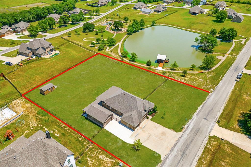 an aerial view of a house with a swimming pool