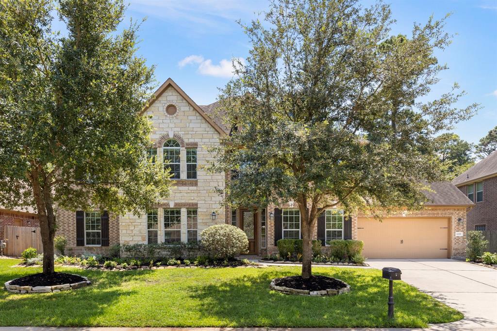 Stunning brick and stone elevation with 3-car garage, beautiful low maintenance landscaping and so much more.