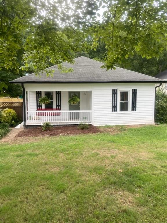 a house with huge green field in front of it