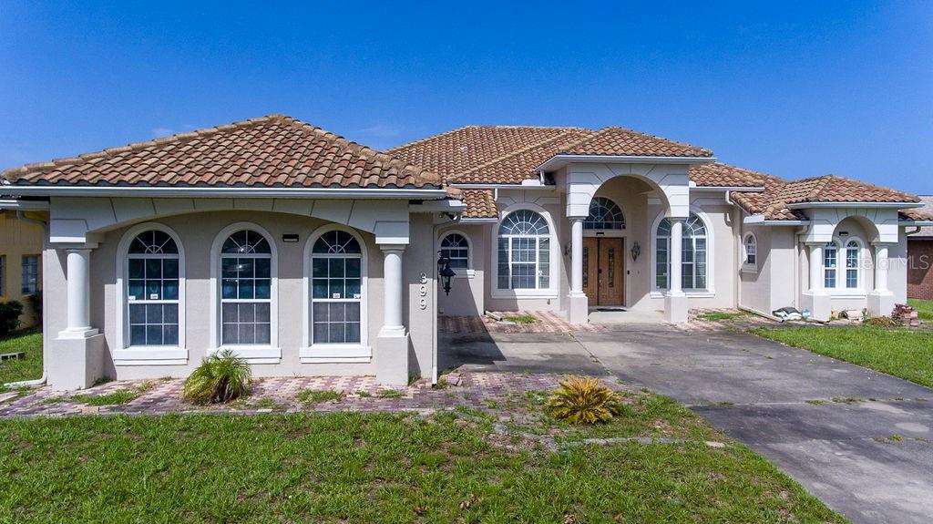 front view of a house with a yard