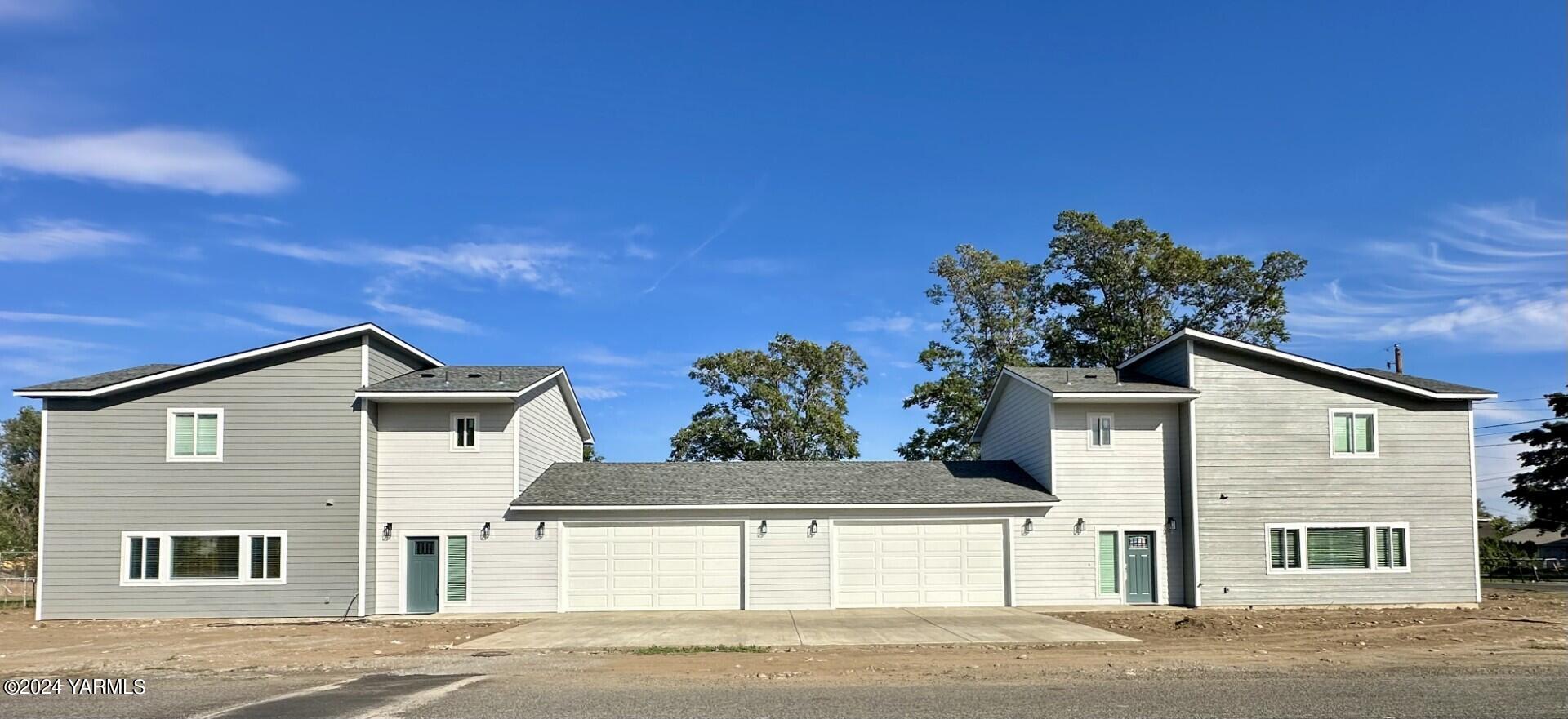 a view of a house with a street